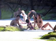 Cauã Reymond e a namorada, Mariana Goldfarb, levam filha do ator à praia. Fotos!