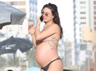 Grávida de 8 meses, Isis Valverde curte praia ao lado do marido no Rio