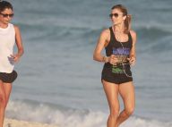 Grazi Massafera corre na praia de shortinho e mostra boa forma ao lado de amiga