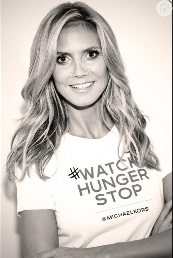 Heidi Klum se sentiu honrada em apoiar o estilista Michael Kors na campanha contra a fome