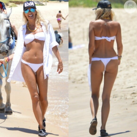 Aos 43 anos, Adriane Galisteu esbanja boa forma com biquíni pequeno em praia