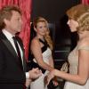 Taylor Swift conversa com Jon Bon Jovi no Palácio de Kensington, em Londres