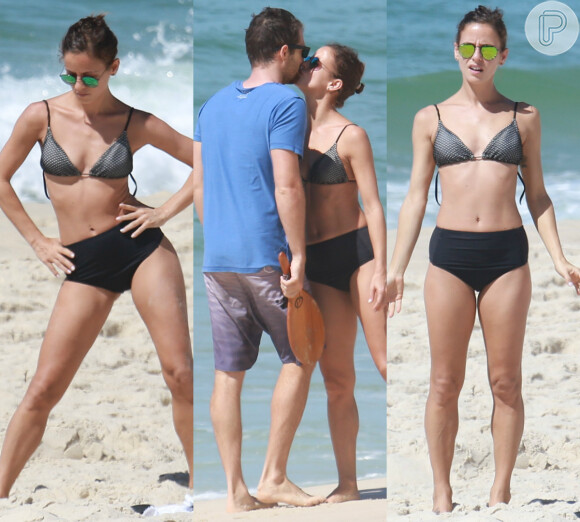 Fernanda de Freitas faz alongamento de biquíni e beija namorado na praia