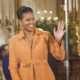 Michelle Obama escolheu um vestido laranja para usar em uma cerimônia realizada pelo presidente Barack Obama na Casa Branca, 2009