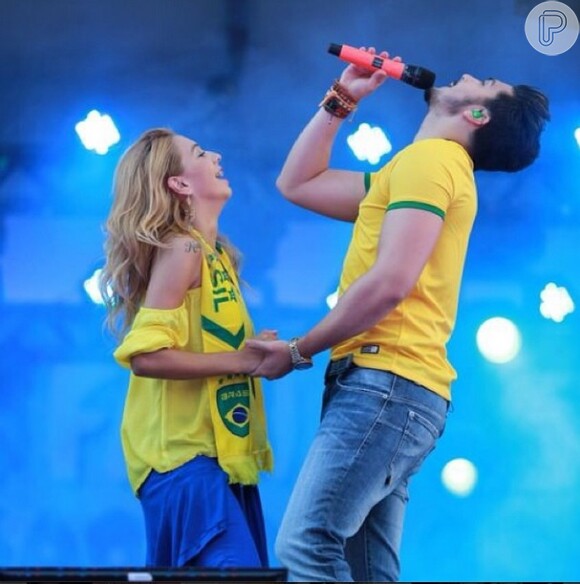 Luan Santana faz show vestindo camisa do Brasil em dia de jogo da Seleção contra Camarões