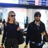 Flávia Alessandra embarcou no aeroporto Santos Dumont, no Rio de Janeiro, acompanhada do seu assessor de imprensa, Diego Senra, nesta quinta-feira, 31 de julho de 2014
