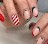 Unhas para o Natal: essa versão de nail art mistura cerejas e listras