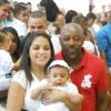 Nando Cunha e a mulher, Flávia, posam no batizado do filho, Davi, de oito meses, em março de 2013