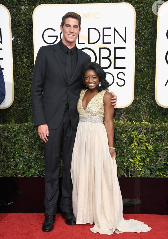 Simone Biles, ao lado do naddor Conor Dwyer, de 1,96 metros. São mais de 50 centímetros de diferença!