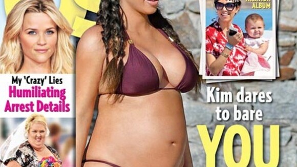 De biquíni, Kim Kardashian exibe barrigão de grávida em capa de revista