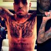 Chris Brown tem os braços e parte do peito fechados por tatuagens
