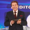 Silvio Santos devolve CD dado por Rafael Cortez durante o 'Programa Silvio Santos', em 23 de novembro de 2014