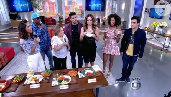 No programa 'Encontro', Ana Furtado experimenta doce de leite, sobremesa preferida da nova Globeleza, Érika Moura, e elogia corpão de dançarina: 'É tudo durinho'