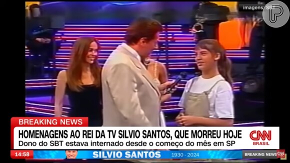 Silvio Santos conversou com Elisa Veeck, na época no elenco da novela 'Chiquititas', durante participação no 'Qual é a Música', em 2000