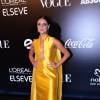 Paloma Bernardi usou vestido amarelo com decote profundo, do estilista Vitor Zerbinato, e joias Carla Amorim para o Baile da Vogue 2016