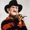 O horrendo assassino em série de 'A Hora do Pesadelo' é Freddy Krueger, interpretado por Robert Englund, em 1984