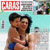 Enzo aparece na capa da revista 'Caras', no colo de Claudia Raia, em 2000