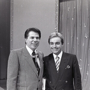 Gugu Liberato chegou à TV através de Silvio Santos nos anos 1970; na foto de 1988, apresentador passa a dividir o domingo com o dono do SBT