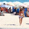 Erika Mader curtiu o sábado, 17 de janeiro de 2015, na praia do Leblon, na Zona Sul do Rio. De biquíni, a sobrinha de Malu Mader exibiu sua barriga de grávida