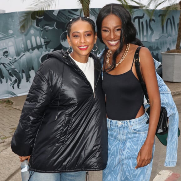 The Town: Taís Araujo foi com uma camisa branca, calça jean e uma jaqueta preta. Já Pathy Dejesus seguiu a tendência do festival foi com calça cargo e maio cavado.