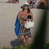 Vivianne Araújo foi à praia do Recreio dos Bandeirantes, na Zona Oeste do Rio, nesta terça-feira, 14 de julho de 2015. De biquíni, a artista mostrou que continua em excelente forma