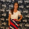 Giovanna Antonelli posa sorridente para fotos com roupas da TNG