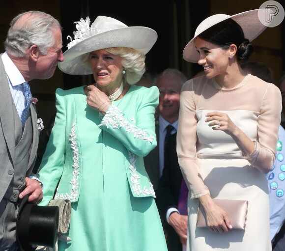No primeiro evento juntos após o casamento, Meghan e Príncipe Charles demonstraram intimidade