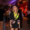 Looks dos famosos do Lollapalooza: Julianne Trevisol também abusou do body amarelo em sua combinação com vestido com amarração na barra e tênis lilás