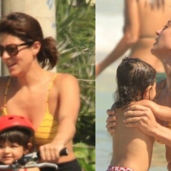 Carol Castro passeou de bicicleta e se refrescou no mar com a filha, Nina, de 1 ano