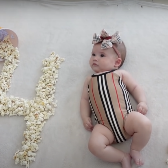 Virgínia até se divertiu com as pipocas do cenário improvisado dos 4 meses da filha