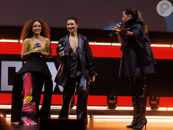 Looks dos famosos na CCXP 24: Alanis Guillen ousou com um look estiloso e decotado, junto de Letícia Vieira, que apostou em um estilo mais urbano