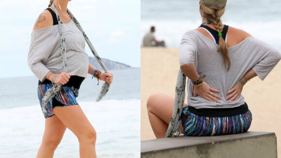 Luana Piovani faz exercícios durante a gravidez e se alonga em praia do Rio