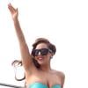 Lady Gaga acena de biquíni para fãs na piscina do Hotel Fasano, em novembro de 2012, durante passagem pelo Brasil