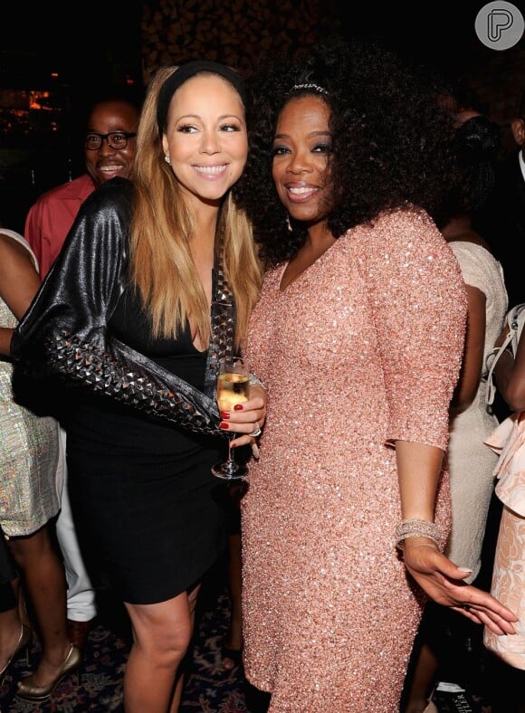 Mariah Carey posa ao lado da apresentadora Oprah Winfrey, que também faz parte do elenco do filme 'The Butler'