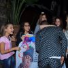 Nego do Borel posa com fãs na porta de sua festa de aniversário no Rio, nesta terça-feira, 12 de julho de 2016