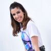 A blogueira de moda Camila Coutinho no SPFW com saia de couro Ellus, botas Chanel e bolsa Dior
