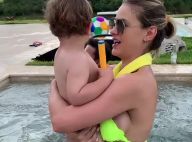De biquíni neon verde, Andressa Suita brinca com filho Gabriel em piscina. Vídeo