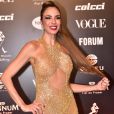 Baile da Vogue: Luciana Gimenez apostou no ouro e na transparência com vestido todo bordado. O aplique no cabelo e o penteado deixaram o look de Gimenez mais glam