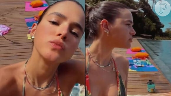 Bruna Marquezine optou por usar um biquíni tie-dye em sua viagem à Bahia, e prendeu o cabelo para curtir a piscina