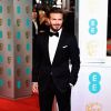 David Beckham posa no tapete vermelho do BAFTA. Ex-jogador será um dos apresentadores da premiação, que acontece nesta noite, 8 de fevereiro de 2015, em Londres