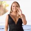 Mariah Carey adora um vestidinho justo e compareceu ao evento decotada, com um preto nada básico