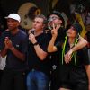 Anitta foi à comunidade carioca com Pharrell Williams e Luciano Huck