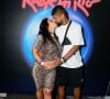 Viviane Araújo, grávida de 9 meses, troca beijo com o marido, Guilherme Militão, no Rock in Rio