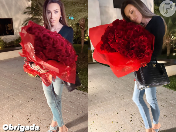 Maya Massafera aparece com um look estiloso e segurando um buquê de flores vermelhas. "Obrigada", disse