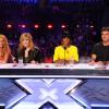 Demi Lovato posa entre as novas juradas, Paulina Rubio e Kelly Rowland, que completam a bancada com Simon Cowell, na estreia das audições do 'The X Factor', nesta terça-feira, 21 de maio de 2013