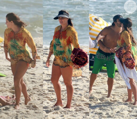 Deborah Secco vai à praia acompanhada do marido, Hugo Moura, e de amigos, ganha beijos, se diverte, mas evita expor o barrigão aos 7 meses de gravidez