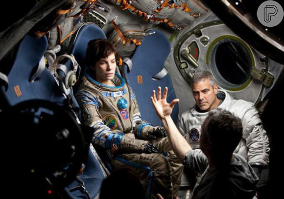 Sandra Bullock ao lado de George Clooney nas gravações de 'Gravidade', que estreia dia 10 de outubro no Brasil