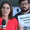 Homem invade a transmissão da Globo News e mostra cartaz contra a TV Globo