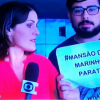 Homem invade a transmissão da Globo News e mostra cartaz contra a TV Globo