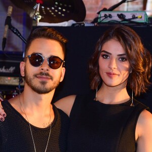 Junior Lima registrou um momento da mulher, Monica Benini, exibindo o barrigão de grávida